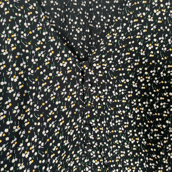 Black and floral blouse with buttons on the front. - Picture 2 of 4